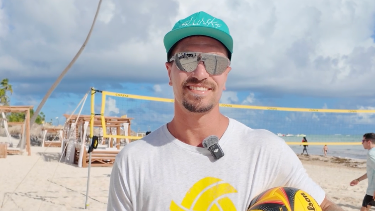 Beach volleyball coach on the sand at a Better at Beach training camp
