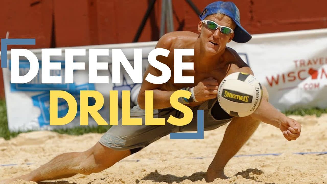 Professional beach volleyball player defending the ball during a drill
