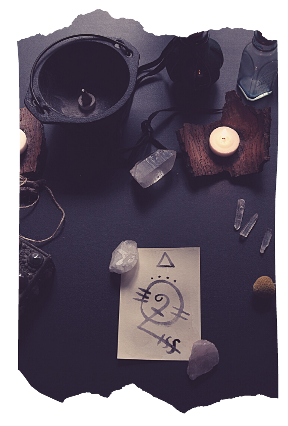 Hand-drawn sigil on paper surrounded by crystals, candles and a cauldron — sigil magic technique in Way of the Mage spellcraft course