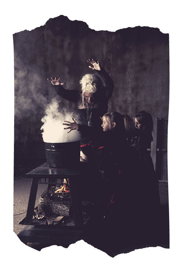 Practitioner raising hands over a smoking cauldron with fire below — guided magical experimentation in Way of the Mage spellcraft course