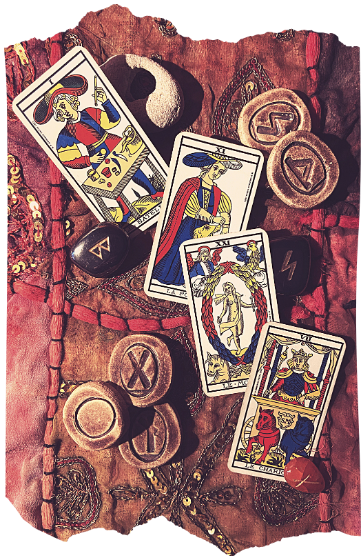 Tarot cards and rune coins spread across a leather-bound book