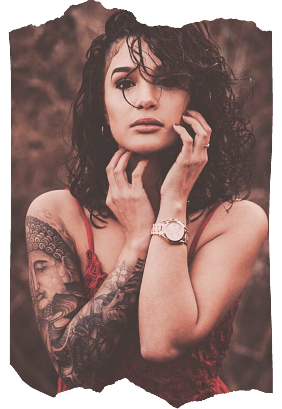 Tattooed woman with focused gaze — the Acolyte archetype for students ready to deepen their spellcraft practice in Way of the Mage