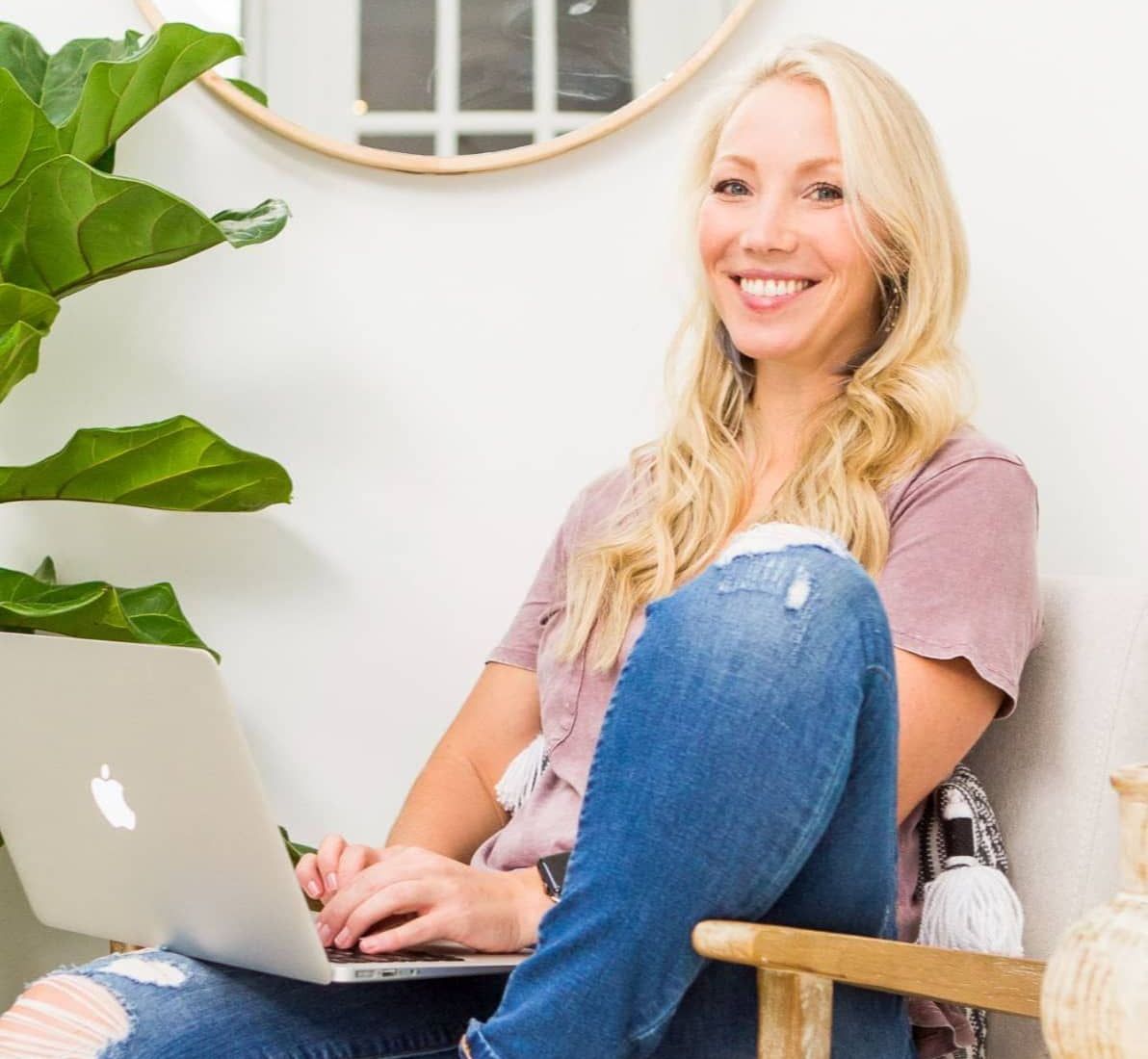 Krissy Chin Sitting With Her Computer