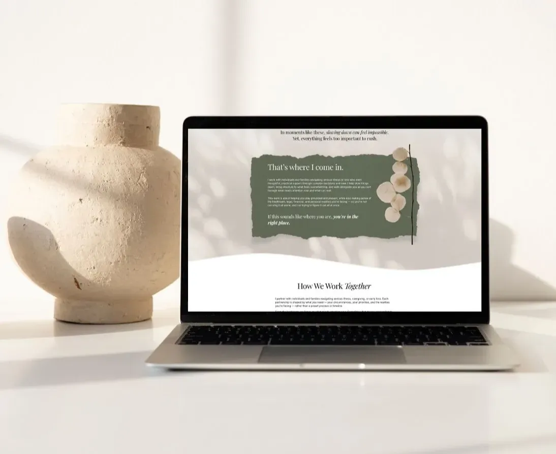 Laptop displaying custom website design by K+C Creative for branding and copywriting services on a modern, neutral workspace desk.
