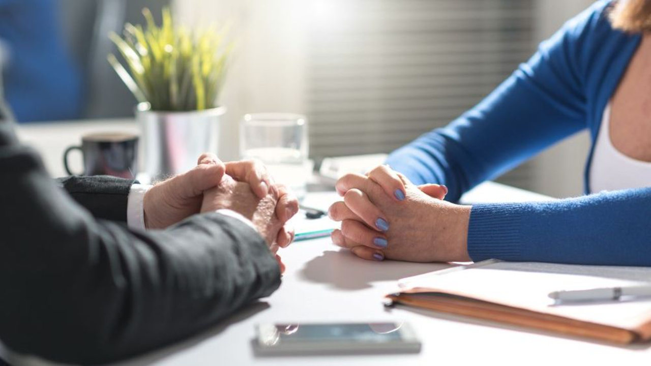 parties sit down to negotiate after reading the best divorce blog posts