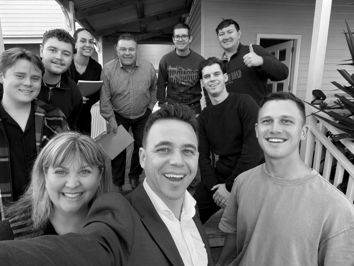 A Retreat group of ten on the verandah with Aaron