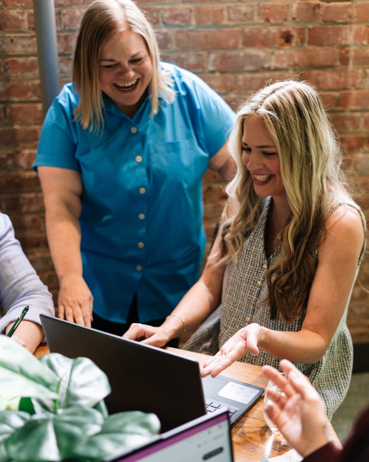 Two women entrepreneurs working together at a laptop
