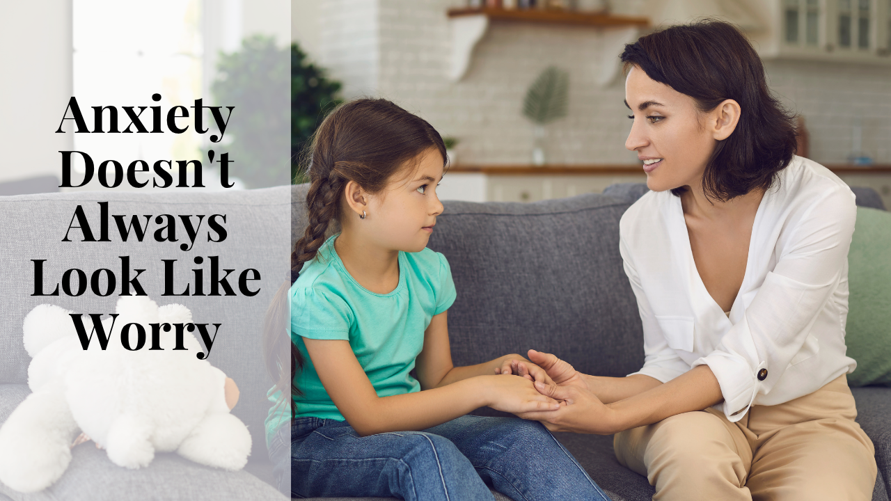 Parent comforting anxious child during childhood anxiety treatment in Rochester NY