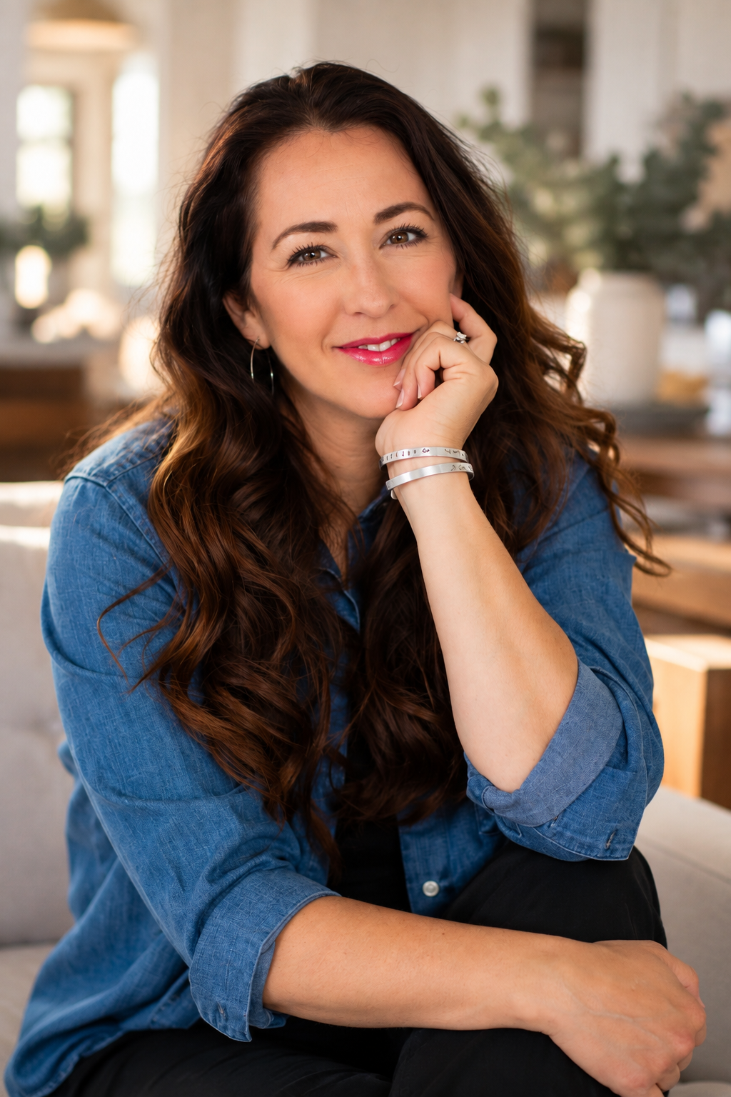 Maria Tedjamulia at home in a denim shirt