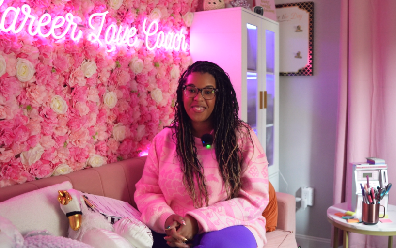 Mercedes Swan Business Coach for Black Women Delivering Training on Couch in Office