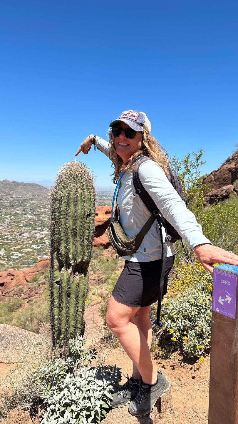 woman over 50 having energy and strength to hike in the mountains