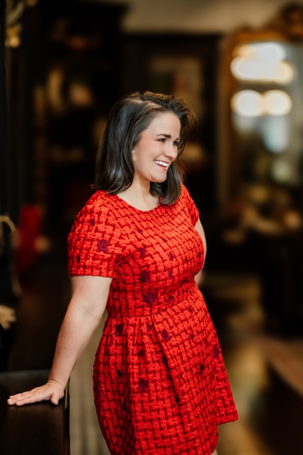 Jordan smiling in a red dress
