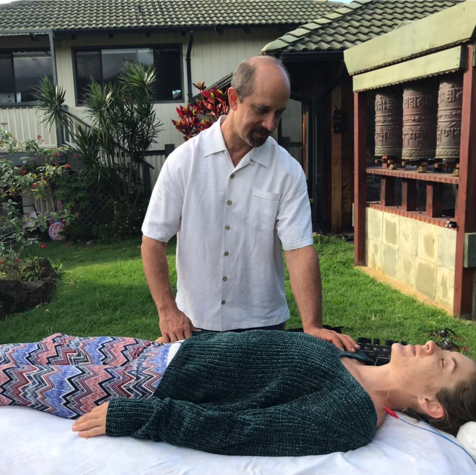 TJ Frank giving a hands-on treatment session outdoors