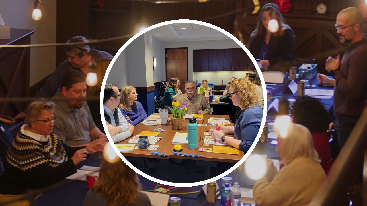 Team members collaborating around a conference table, representing DillonMarcus' Give & Gain Exchange™ team training module