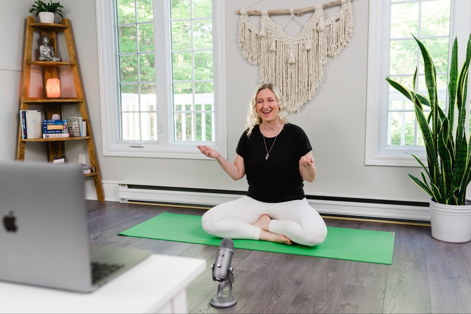 Smiling woman on a yoga mat