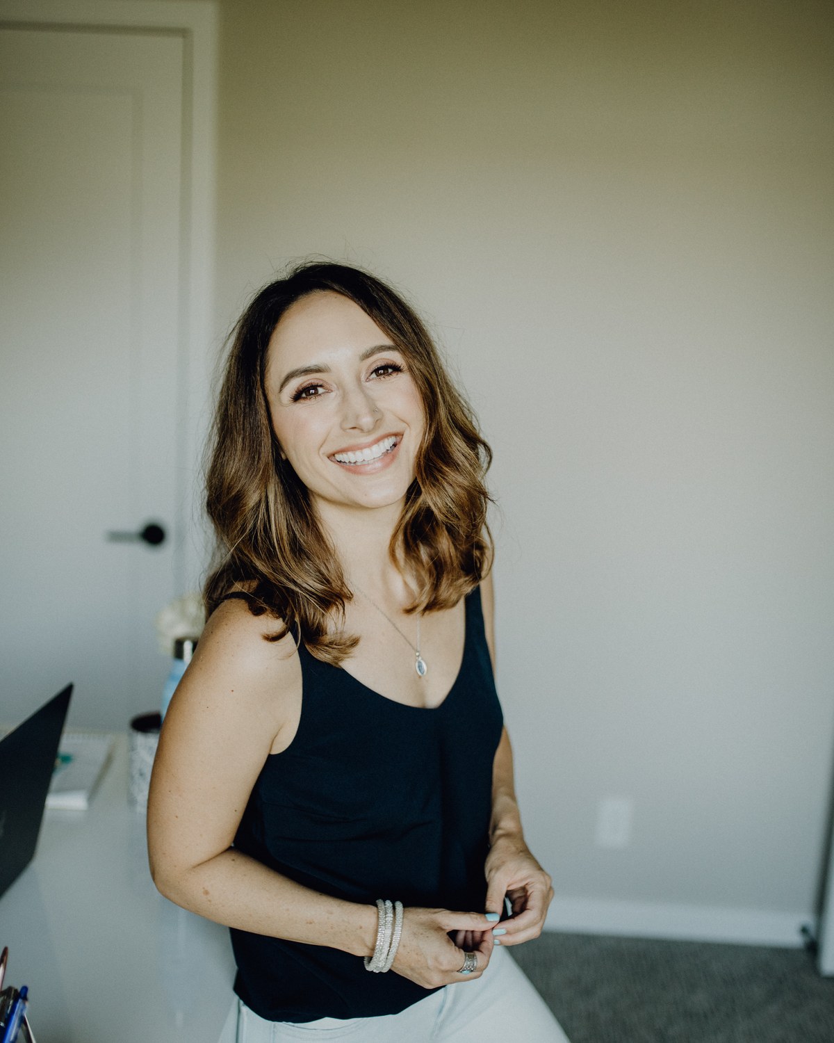 Jen Conger smiling in her home office