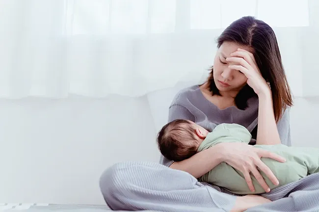 Newborn baby breastfeeding in hospital