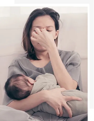 Newborn baby breastfeeding in hospital