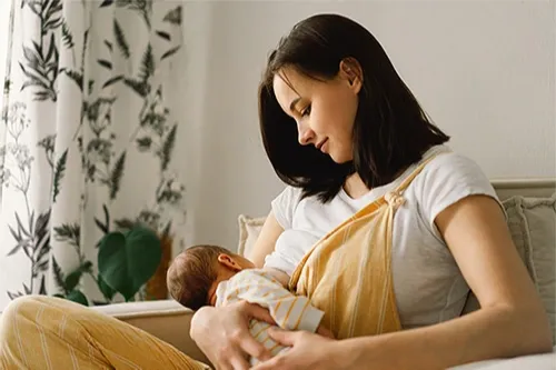 Mother on couch nursing
