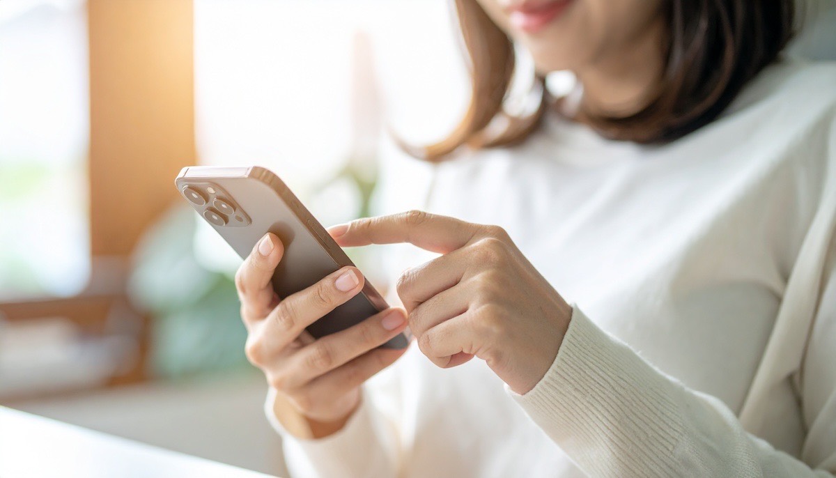 A calm mother using her phone