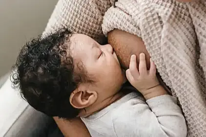 Close up baby breastfeeding