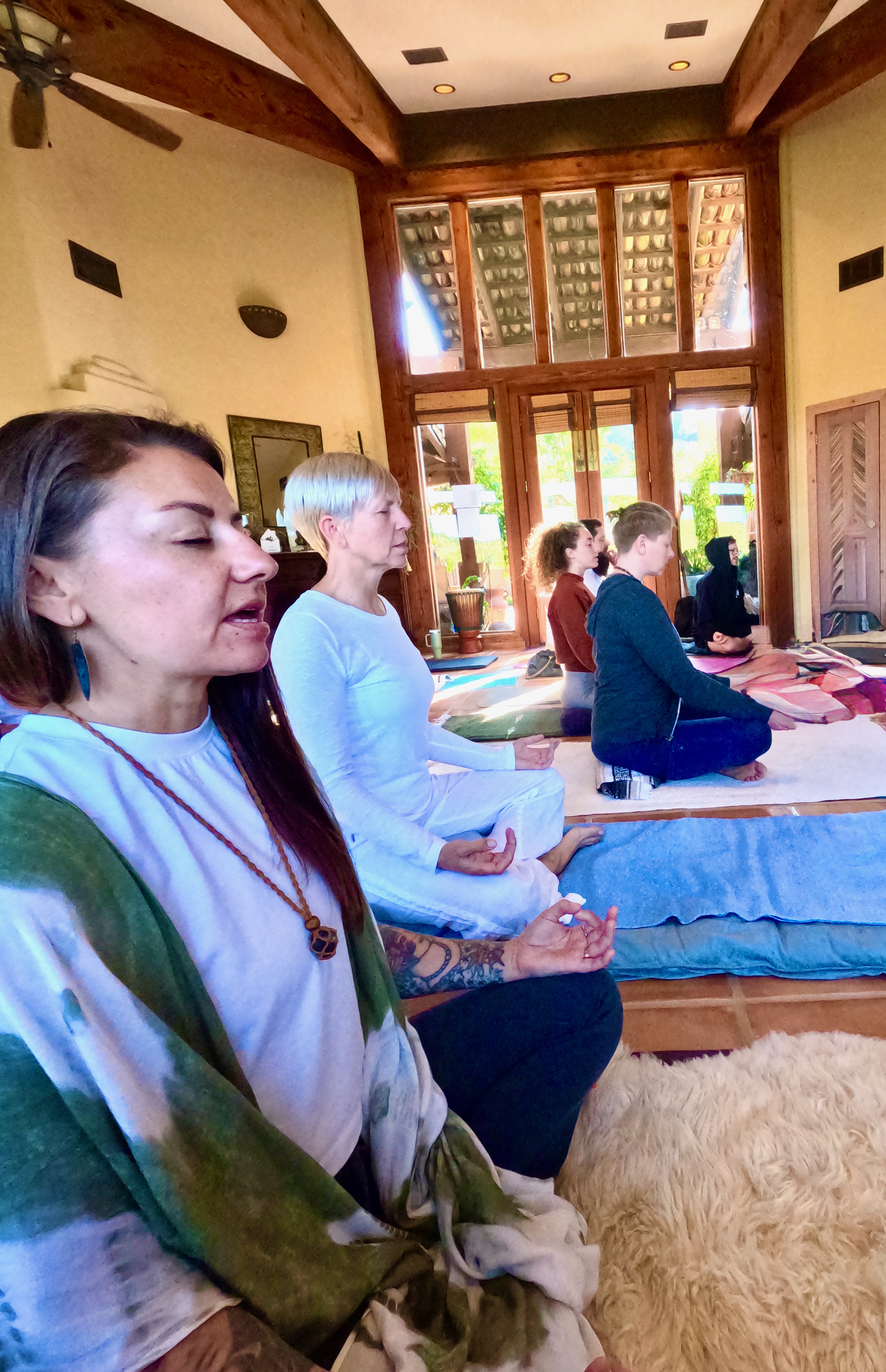 Participants meditating in beautiful natural light