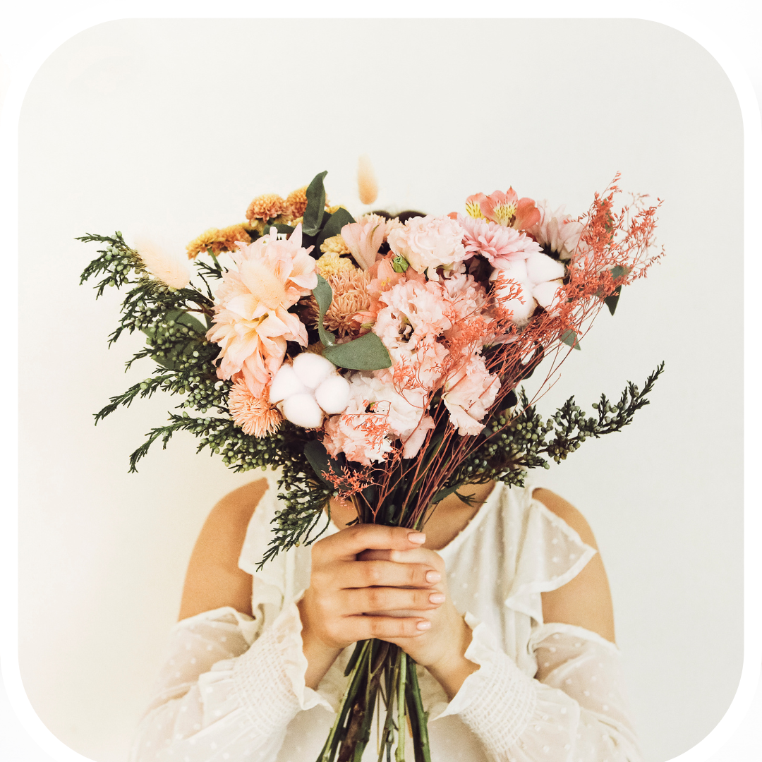 Woman holding a bouquet of flowers