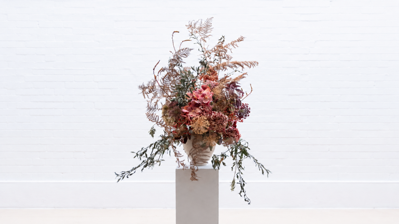 The Statement Vase, a dramatic floral arrangement by Joseph Massie featuring dusky pink orchids, chrysanthemums, dried ferns and trailing foliage, from his Everyday Elevated Masterclass.