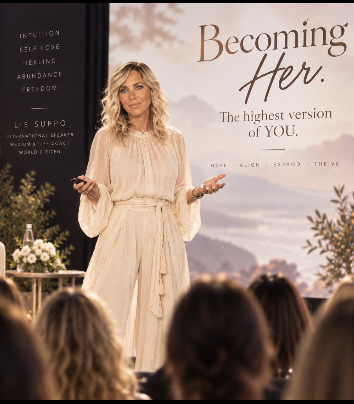 Lis Suppo speaking on stage at a Becoming Her event