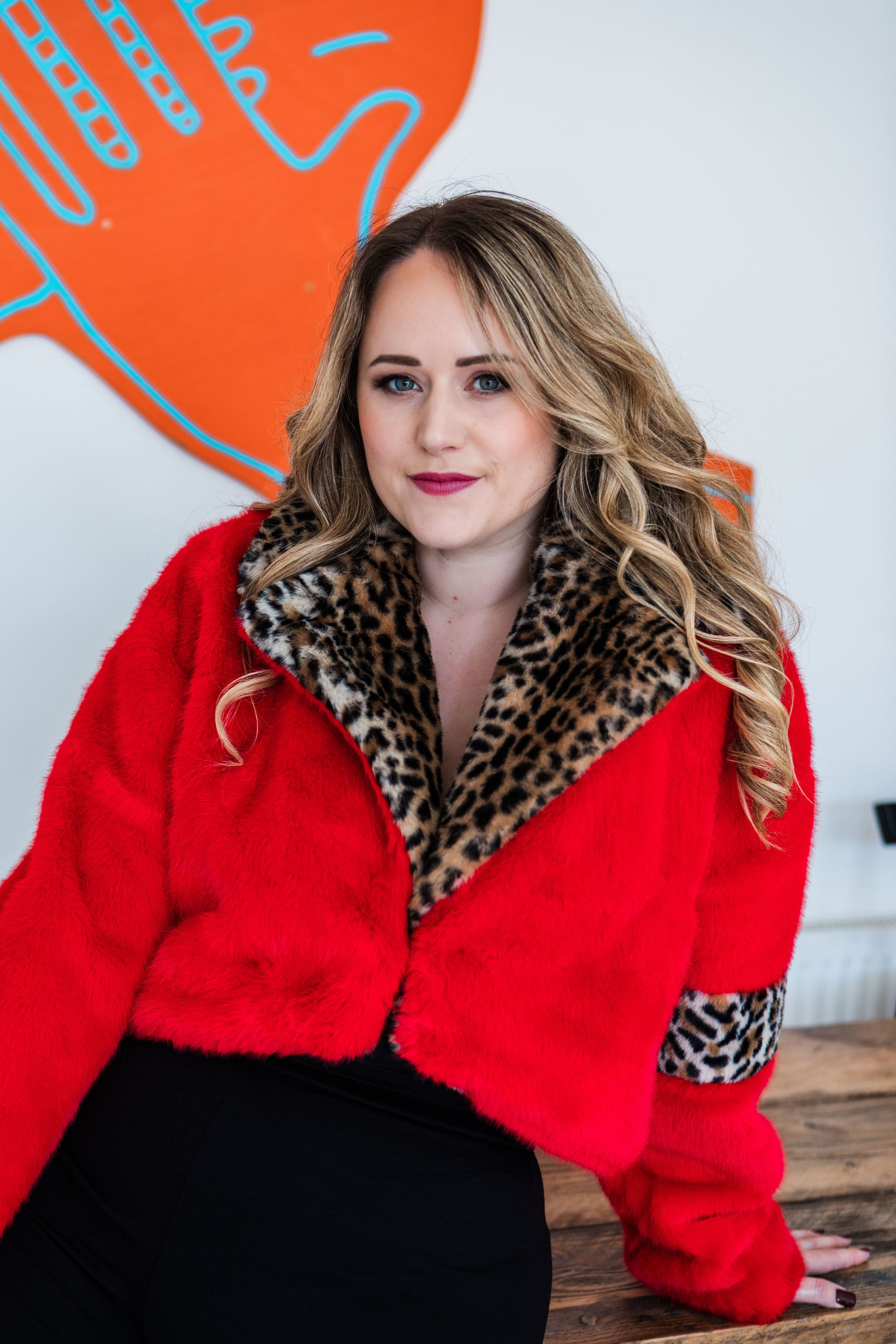 Chantelle in a red faux-fur jacket