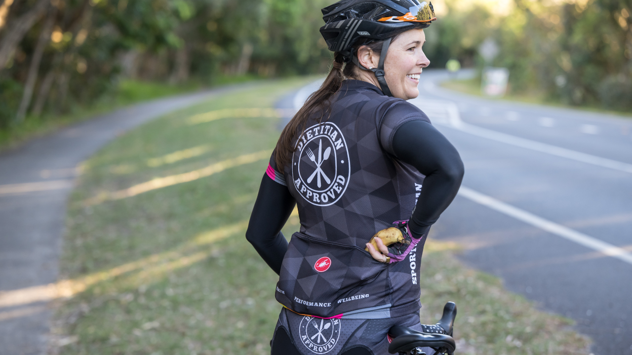 Cyclist on a long build ride practising gut training triathlon carbohydrate intake
