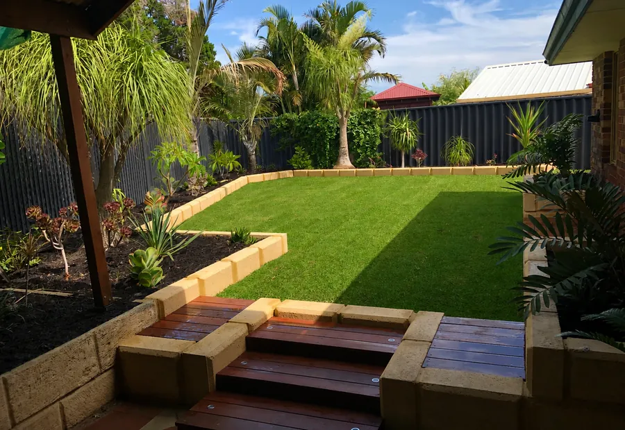 Finished landscaped lawn and painted fence