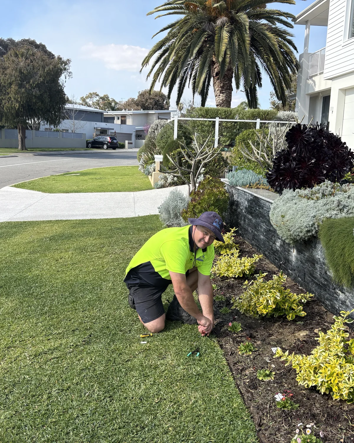 Jeremy Davis working carefully in a garden