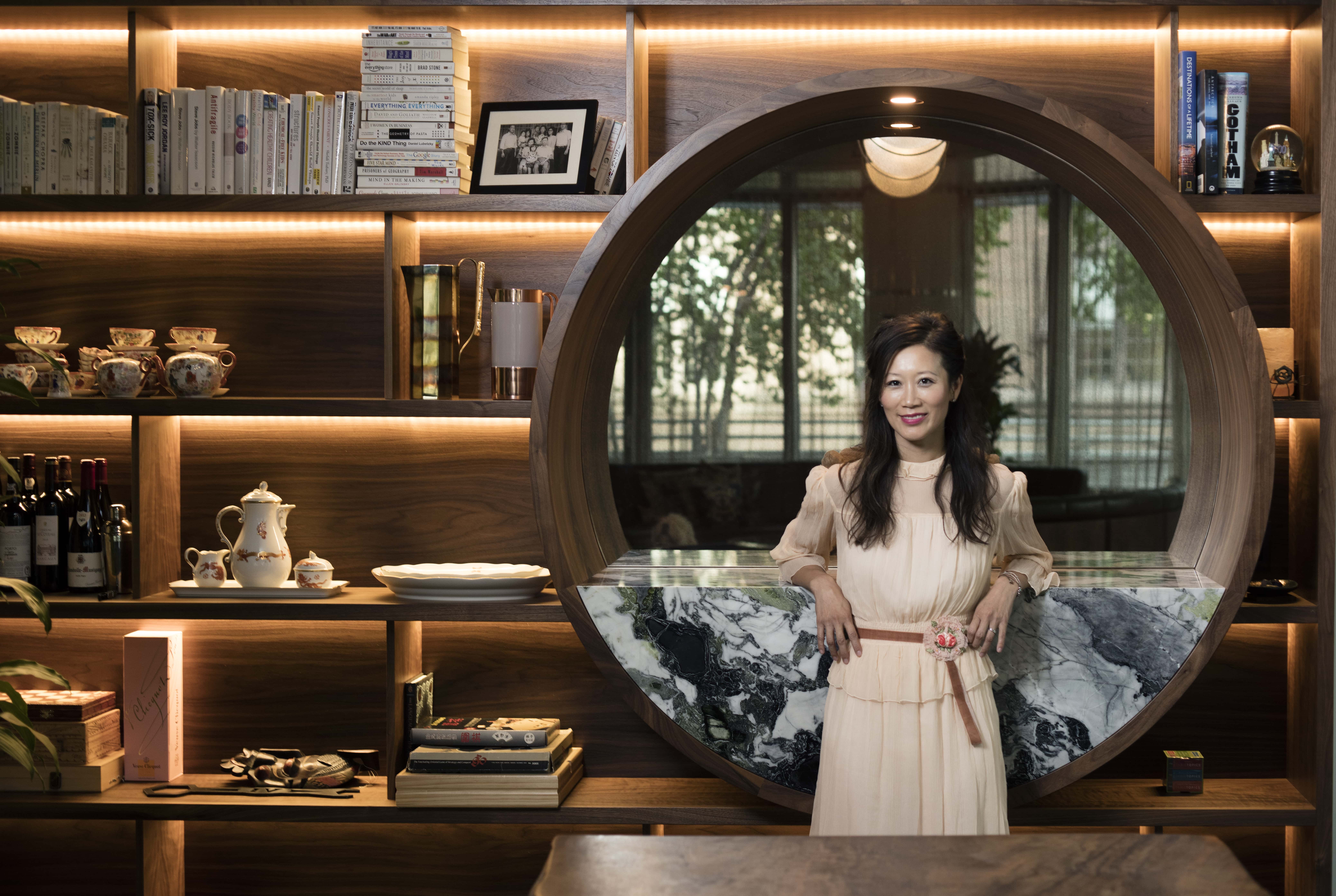 Sophia Ruan Gushée standing in her living room at home.