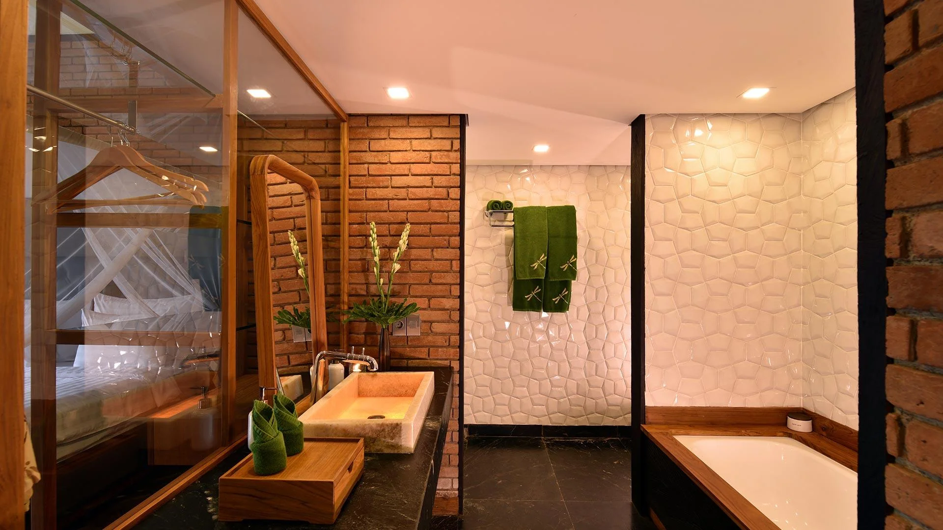 Deluxe Suite bathroom with bathtub and shower