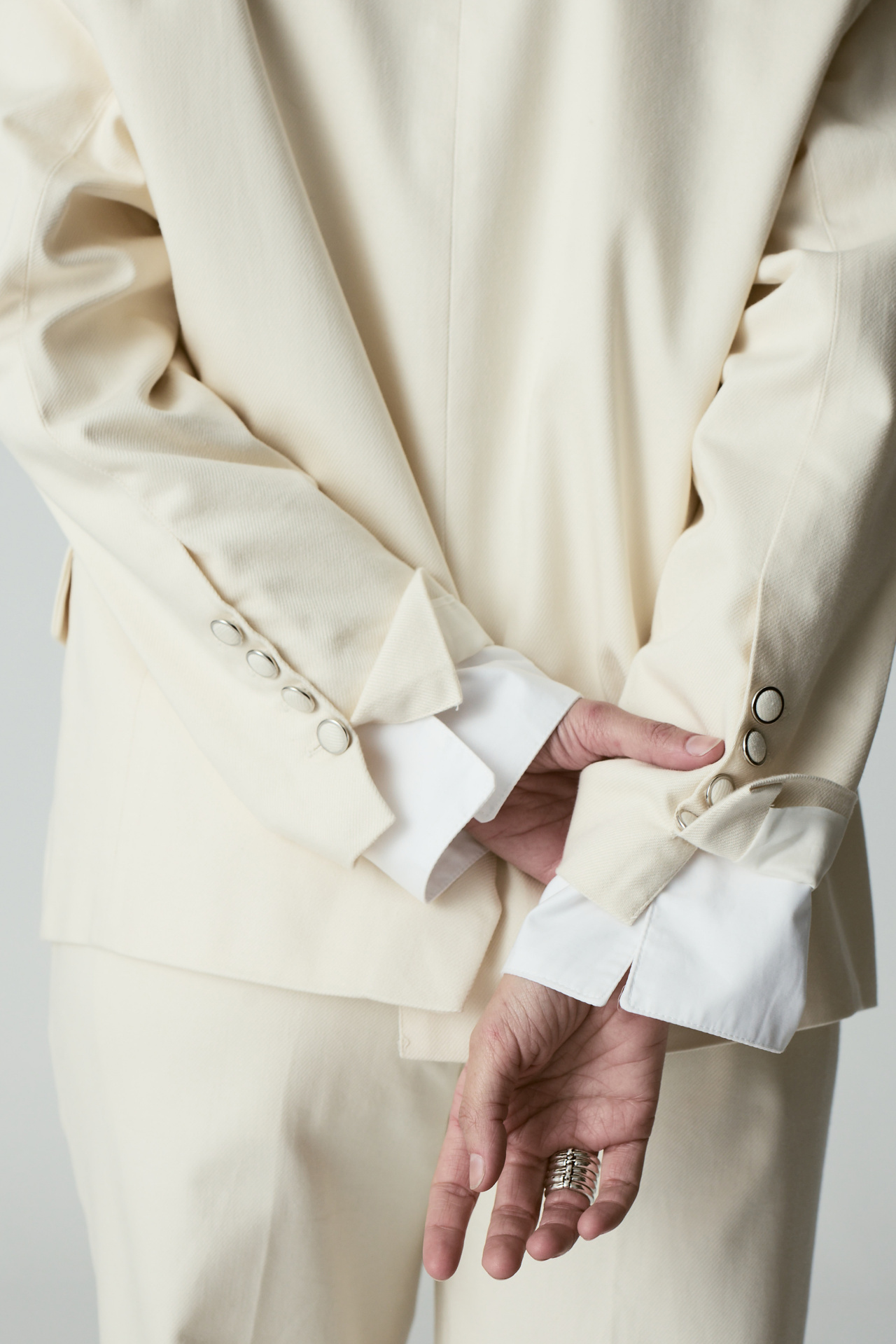 Cream suit cuffs with pearl buttons