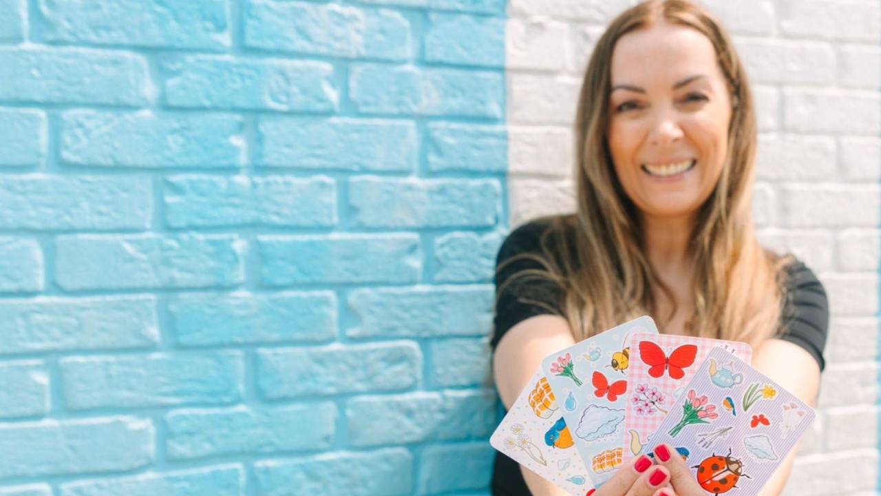 Mim Jenkinson holding sticker sheets