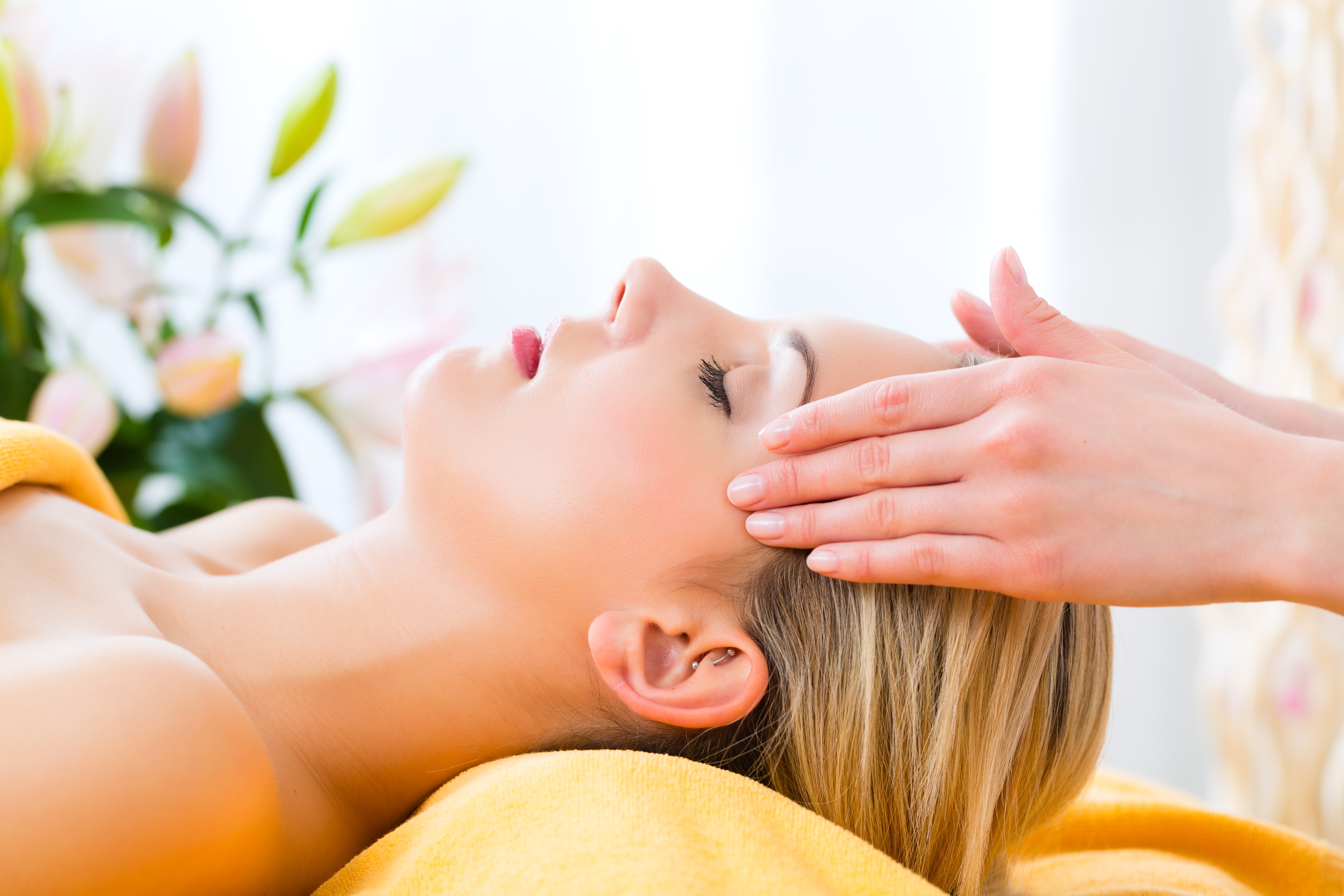 A therapist's hands held softly at the head during a Gentle Release Therapy cranial release