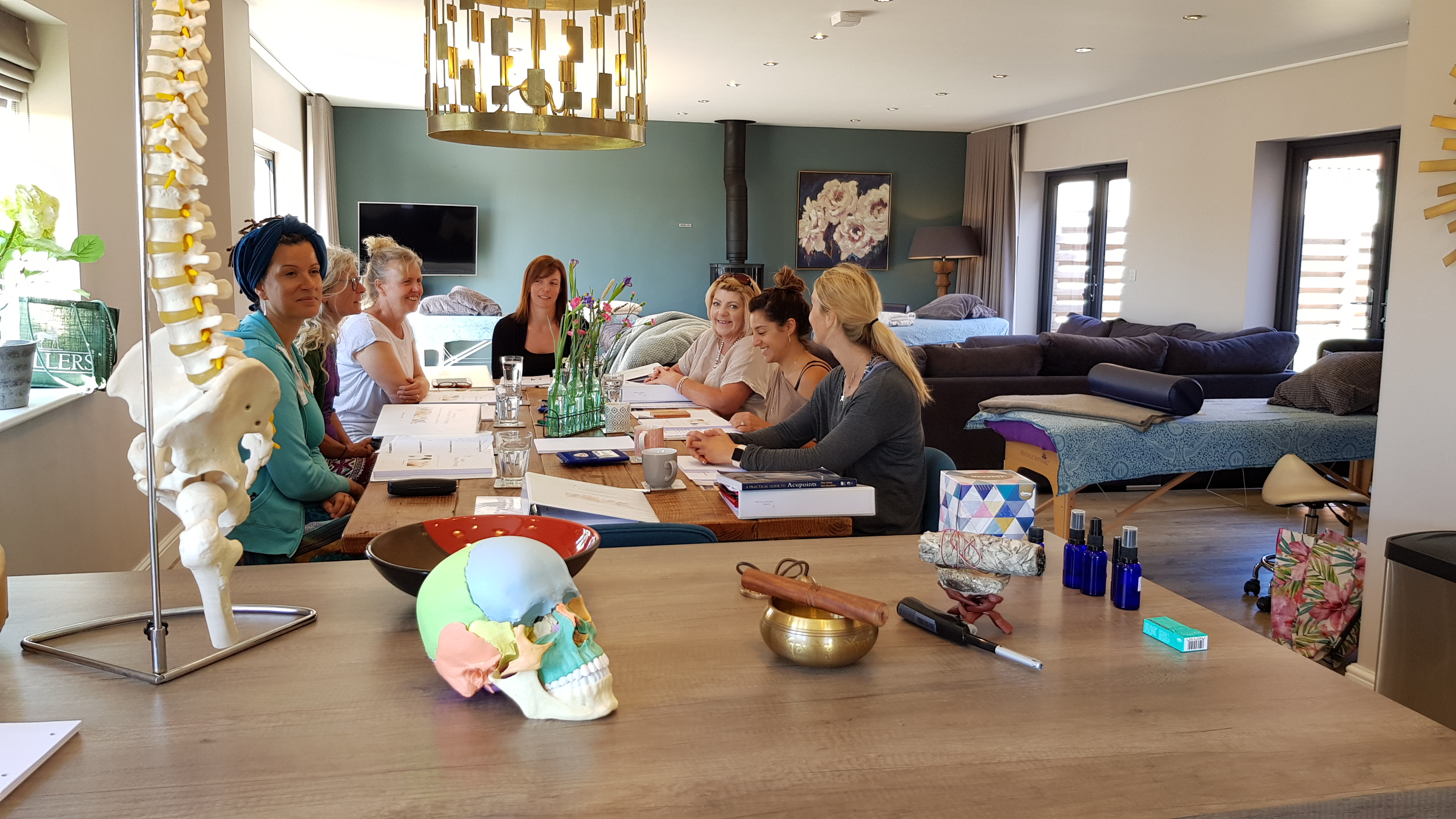 Practitioners gathered around the training table