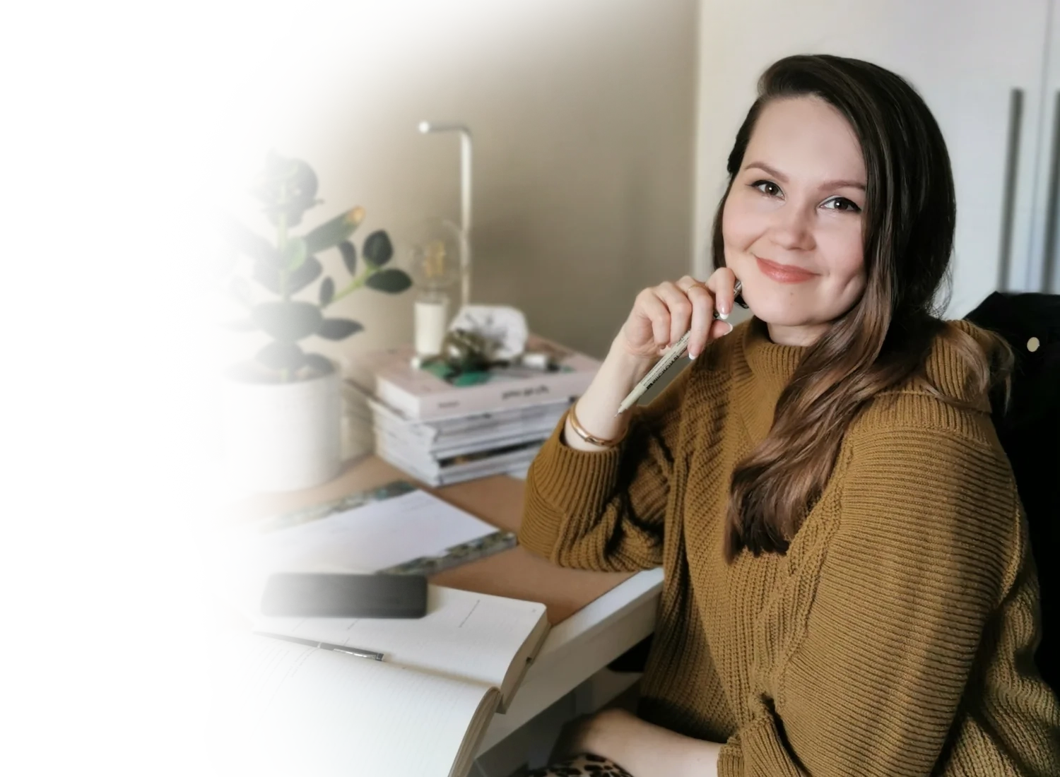 kajabi website developer and brand design expert by her desk