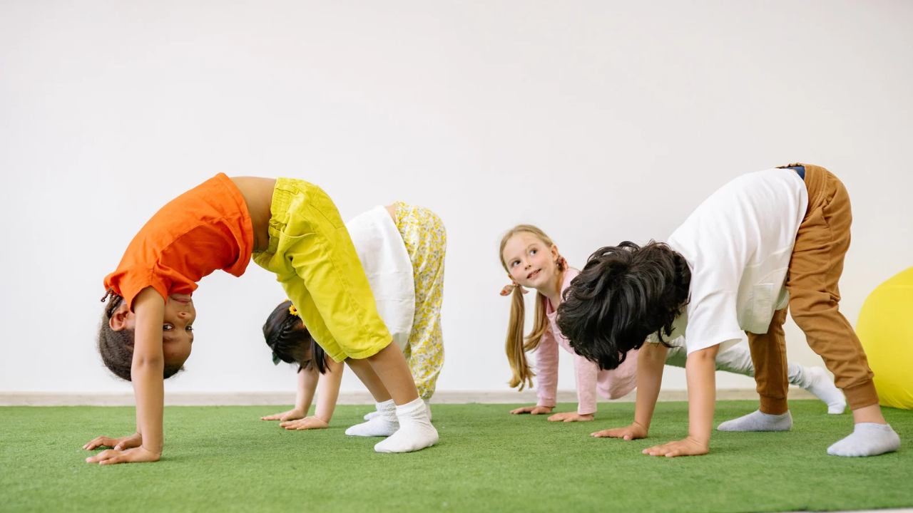 Kids doing a bear animal walk during a therapy session to support strength, coordination, physiotherapy goals and playful speech therapy activities.