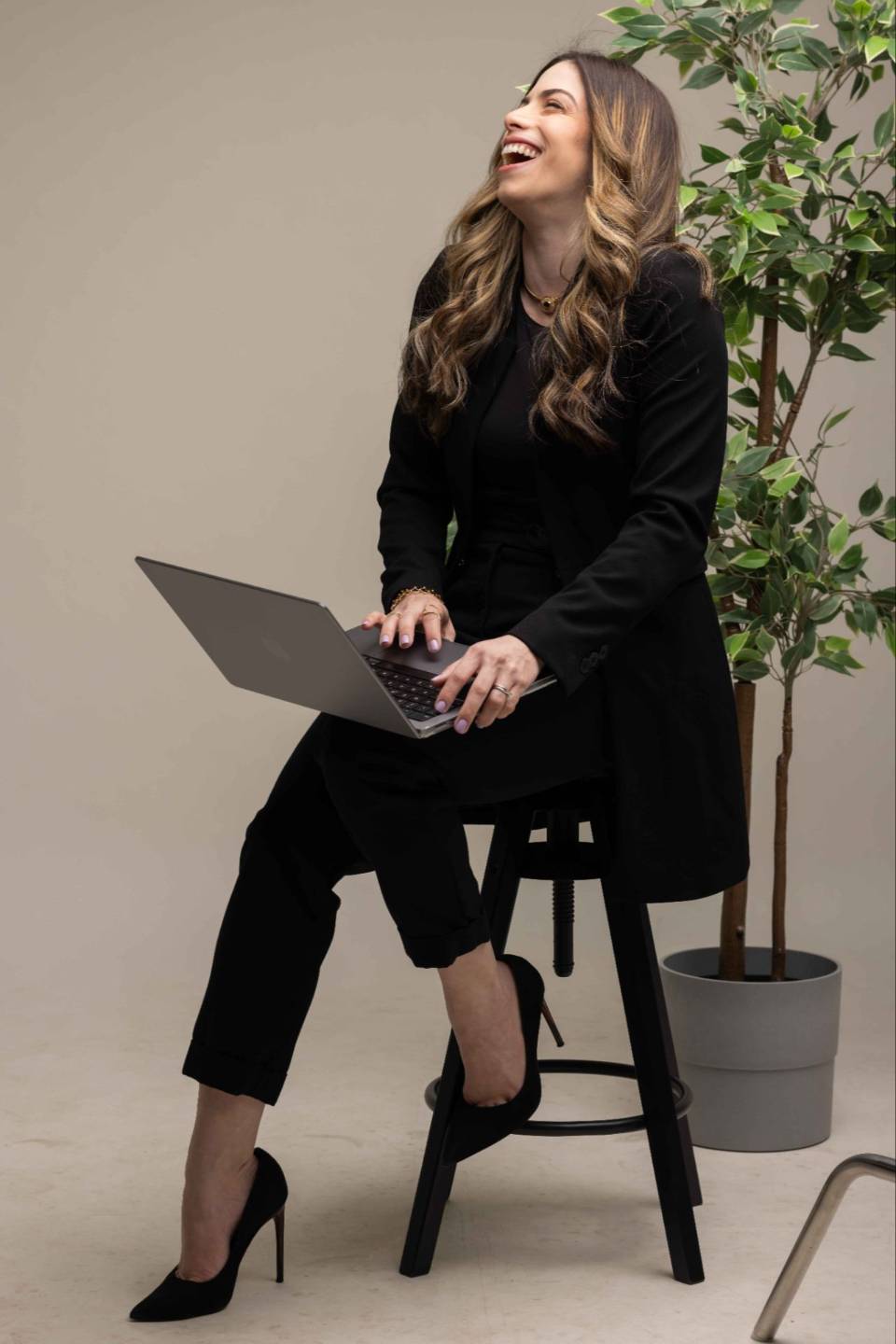 María Cristal working on a Solusync App, her automation platform built on HighLevel