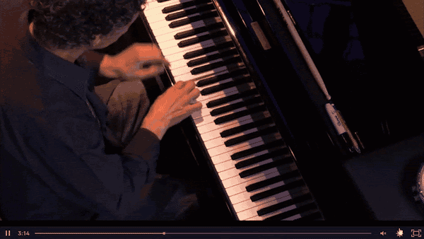 The Kajabi video player on an overhead shot of Chick Corea's hands, with the speed menu open and 0.5x selected