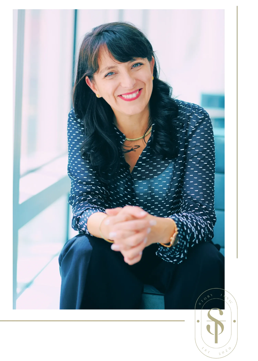 Certified Life and Business Coach Nathalie Pincham standing in front of pink artwork and smiling 