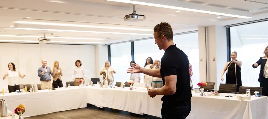 Jay Pottenger running a focus and productivity workshop in a corporate office 