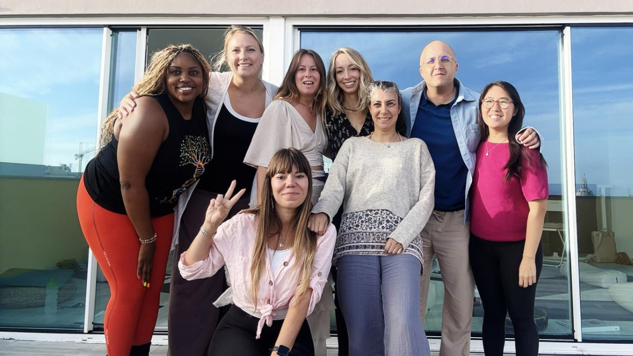 graduates of a sound healer training program standing together after completing the workshop