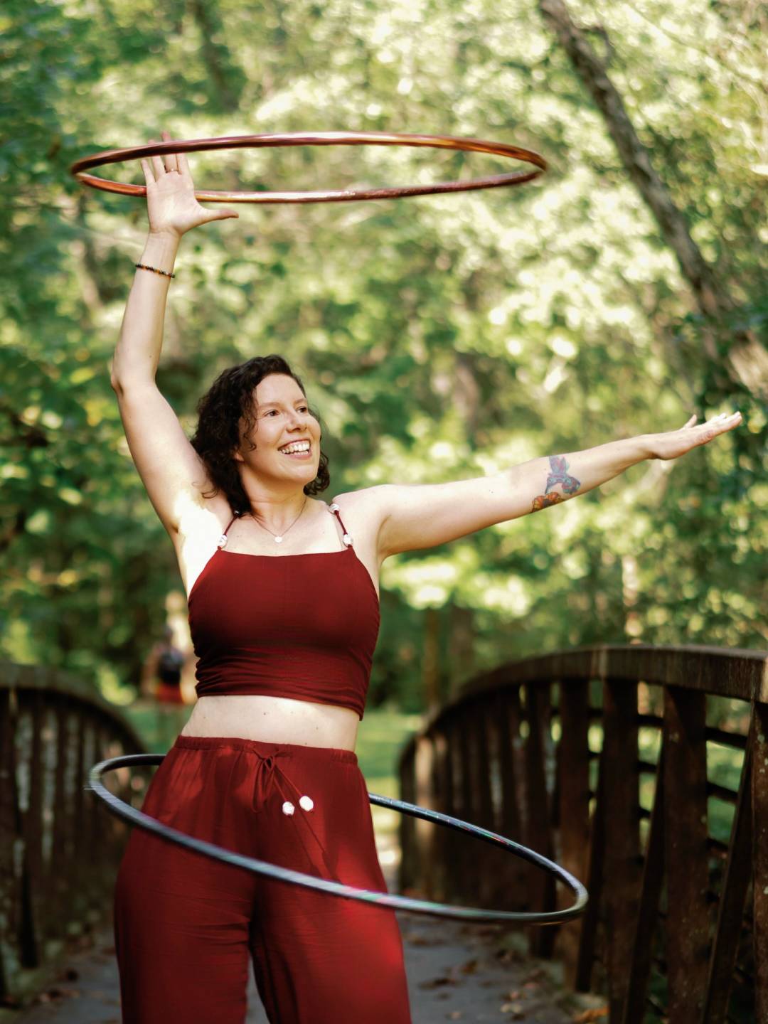 HoopYogini practitioner using a hula hoop as an anchor for moving mindfulness meditation.