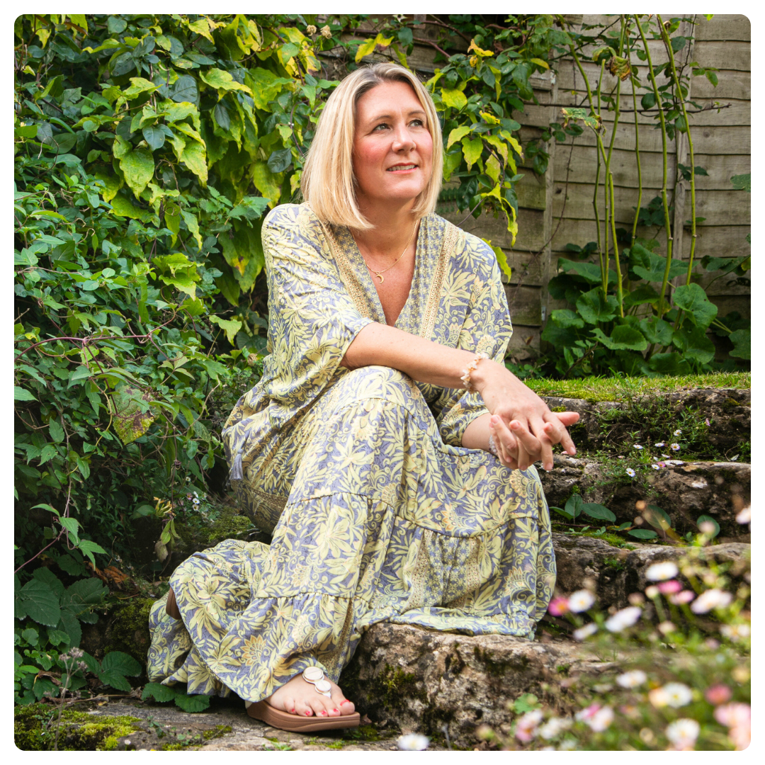 Karen Sutton sitting in front of a professional microphone, smiling warmly. Behind her, framed quotes decorate the wall. The text below introduces group coaching sessions for widows to find hope and healing.