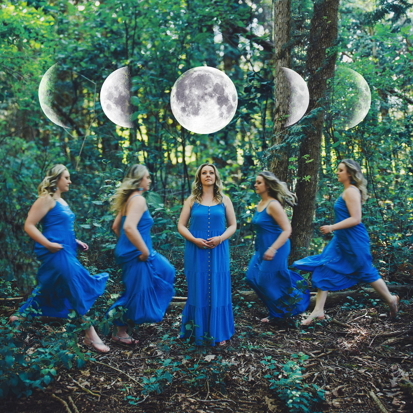 A women in a blue dress standing on the waterfront holding a glowing full moon in the air