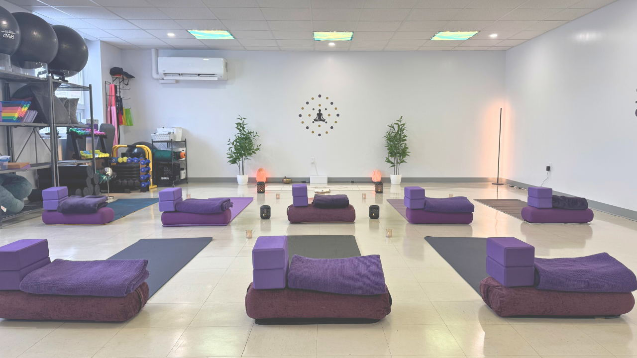 women seated cross-legged in meditative pose